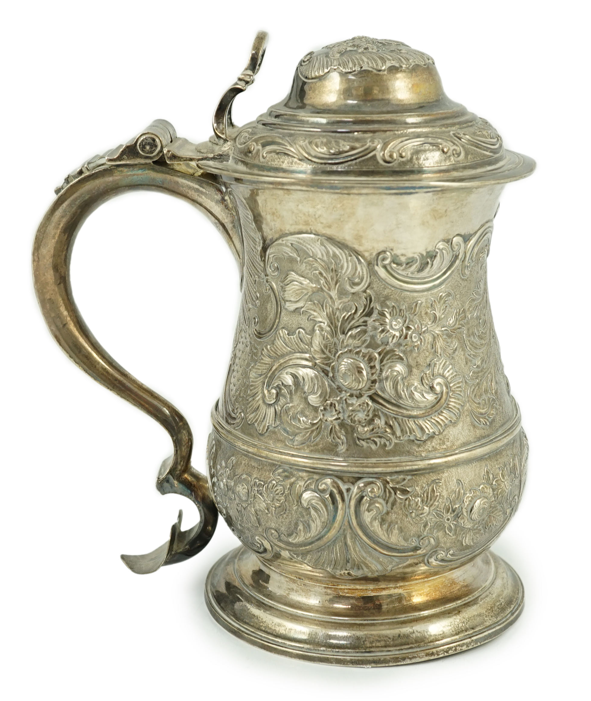 A George II silver baluster tankard, with later embossed decoration, by Robert Albin Cox